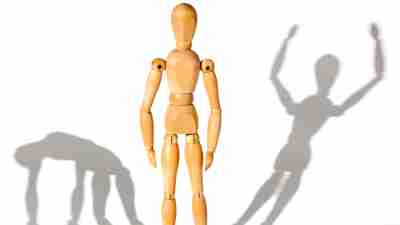 Conceptual representation of bipolar disorder vs. ADHD, wooden doll and his shadow